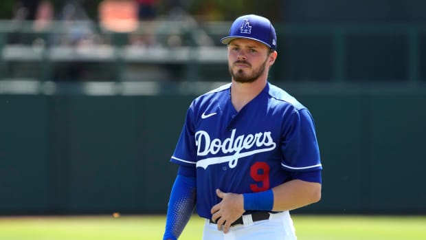 Dodgers infielder Gavin Lux warms up before a game.